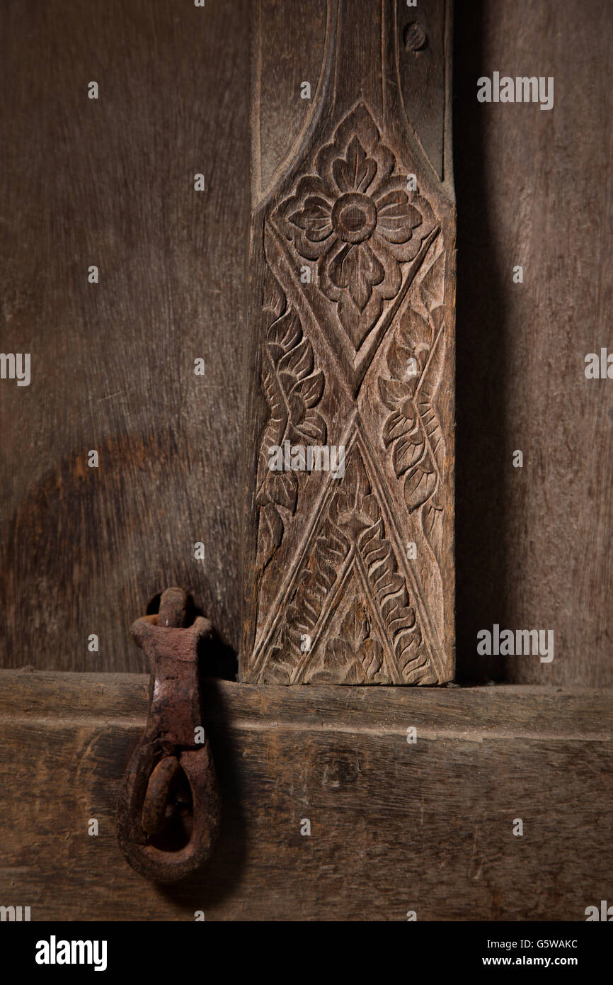 carve door and padlock in ancient thai house Stock Photo