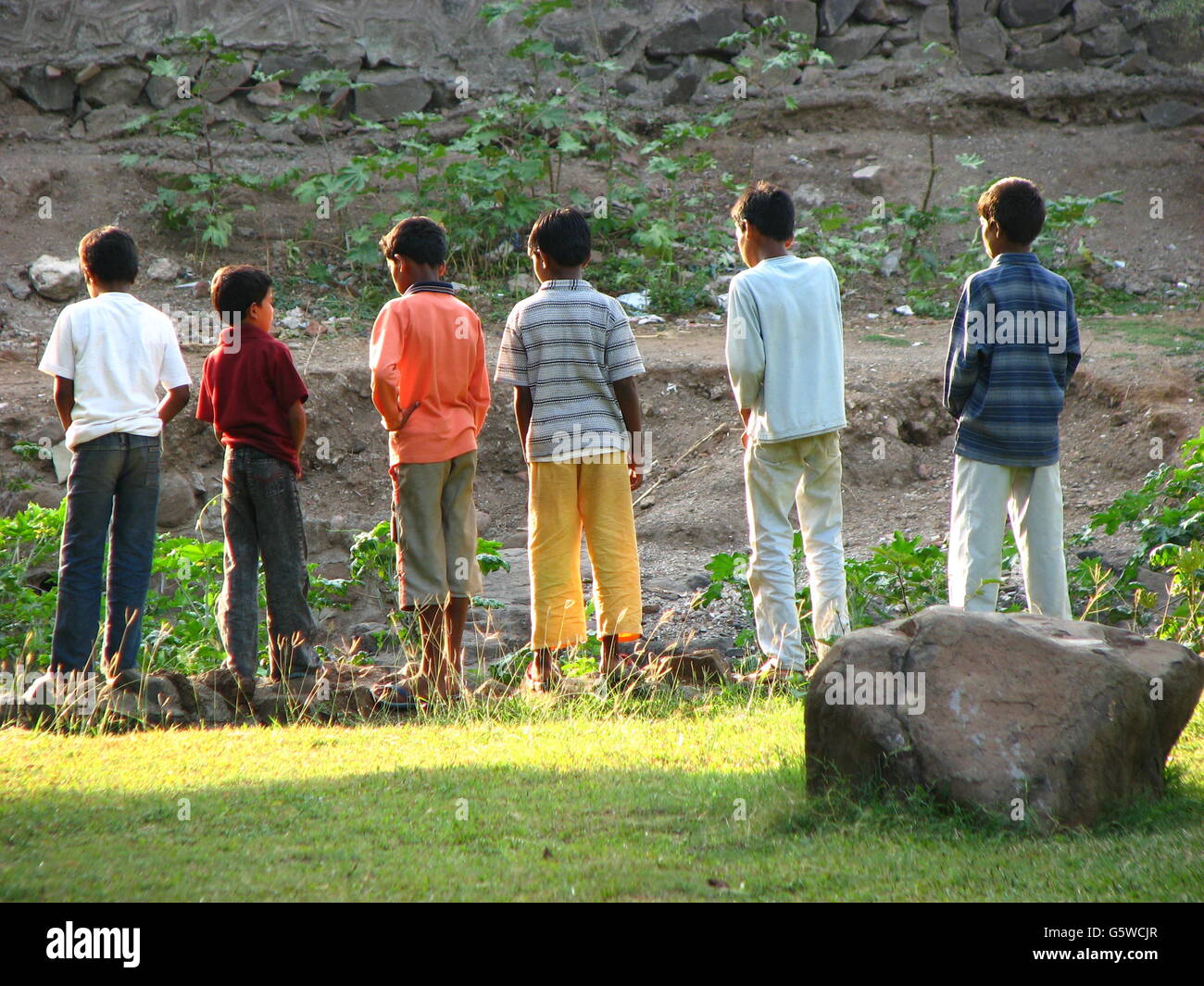 pure nudism peeing  Indian boys peeing in line in the wild Stock Photo - Alamy