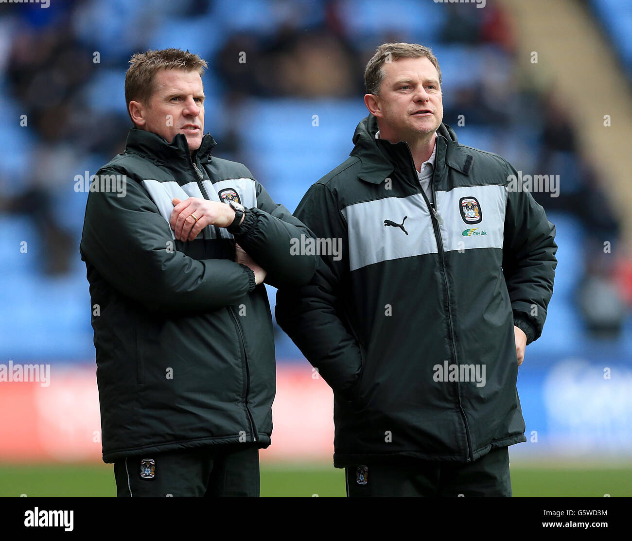 Coventry City manager Mark Robins (right) and first team coach Steve