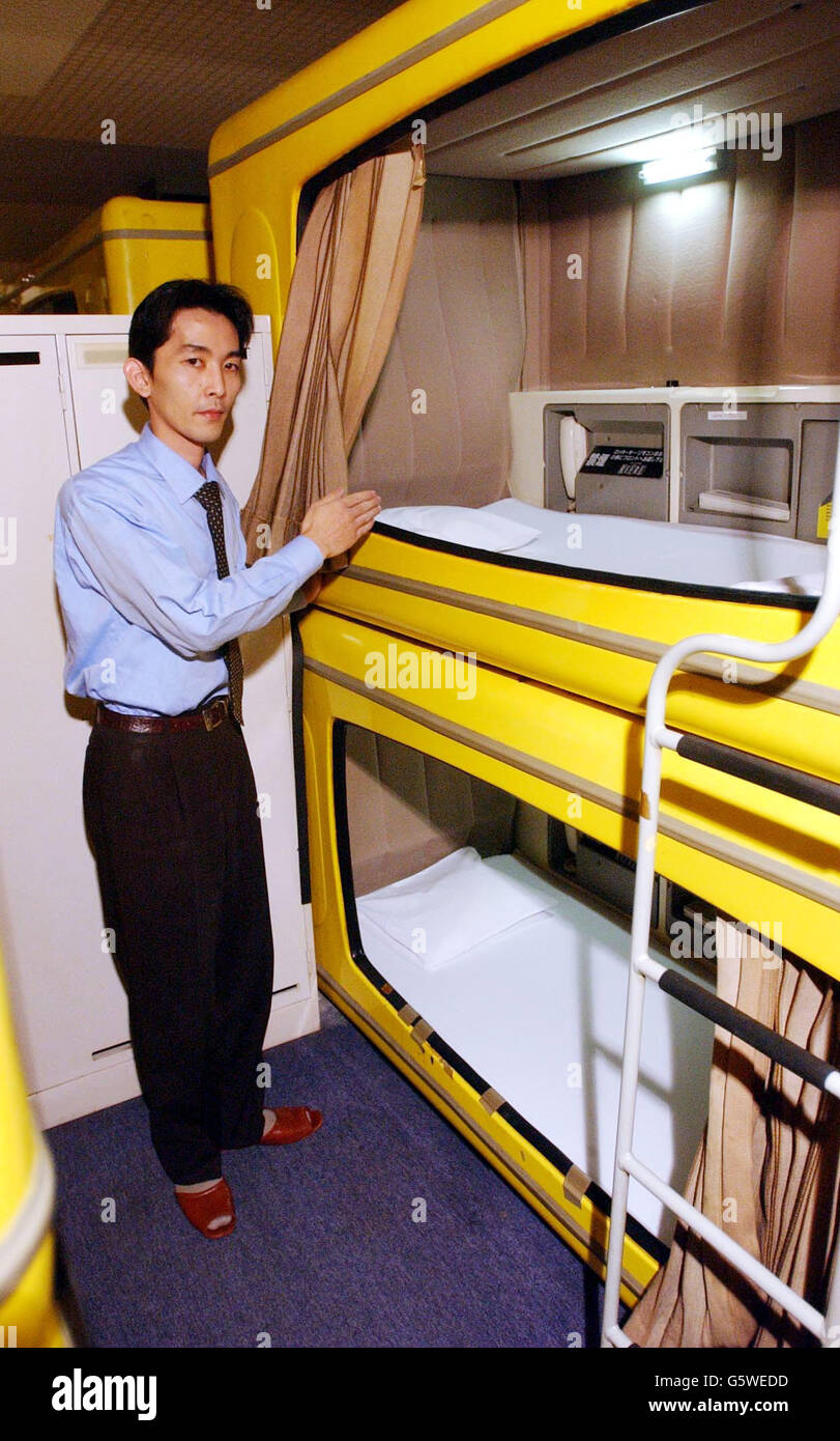 Hotel manager Ryoji Matubara shows one of 175 capsule beds at the Refre Hotel, Sapporo, Japan. The Refre Hotel will provide alternative accommodation for World Cup fans unable to find conventional hotel space. * ... The capsule beds are equiped with TV, phone and lock up safe. Guests will also share toilet and washing facilities and have use of a sauna. England will play Argentina in their second Group F match in Sapporo. Stock Photo