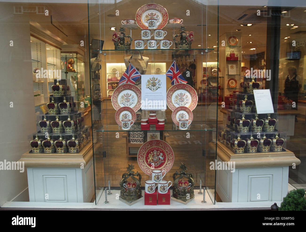 Souvenirs to celebrate the 60th Anniversary of the Coronation on display in the window of Buckingham Palace Shop, in central London. Stock Photo