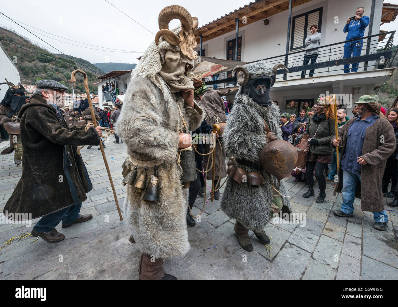 Villagers dressed as goats and goatherds take part in a Pagan, rights of spring, festival held in the village of Nedousa in the Stock Photo