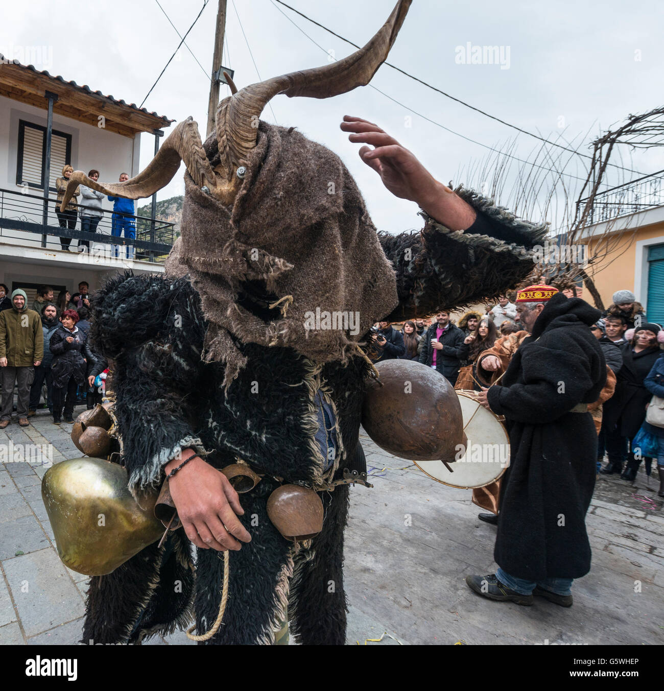 Villagers dressed as goats and goatherds take part in a Pagan, rights of spring, festival held in the village of Nedousa in the Stock Photo