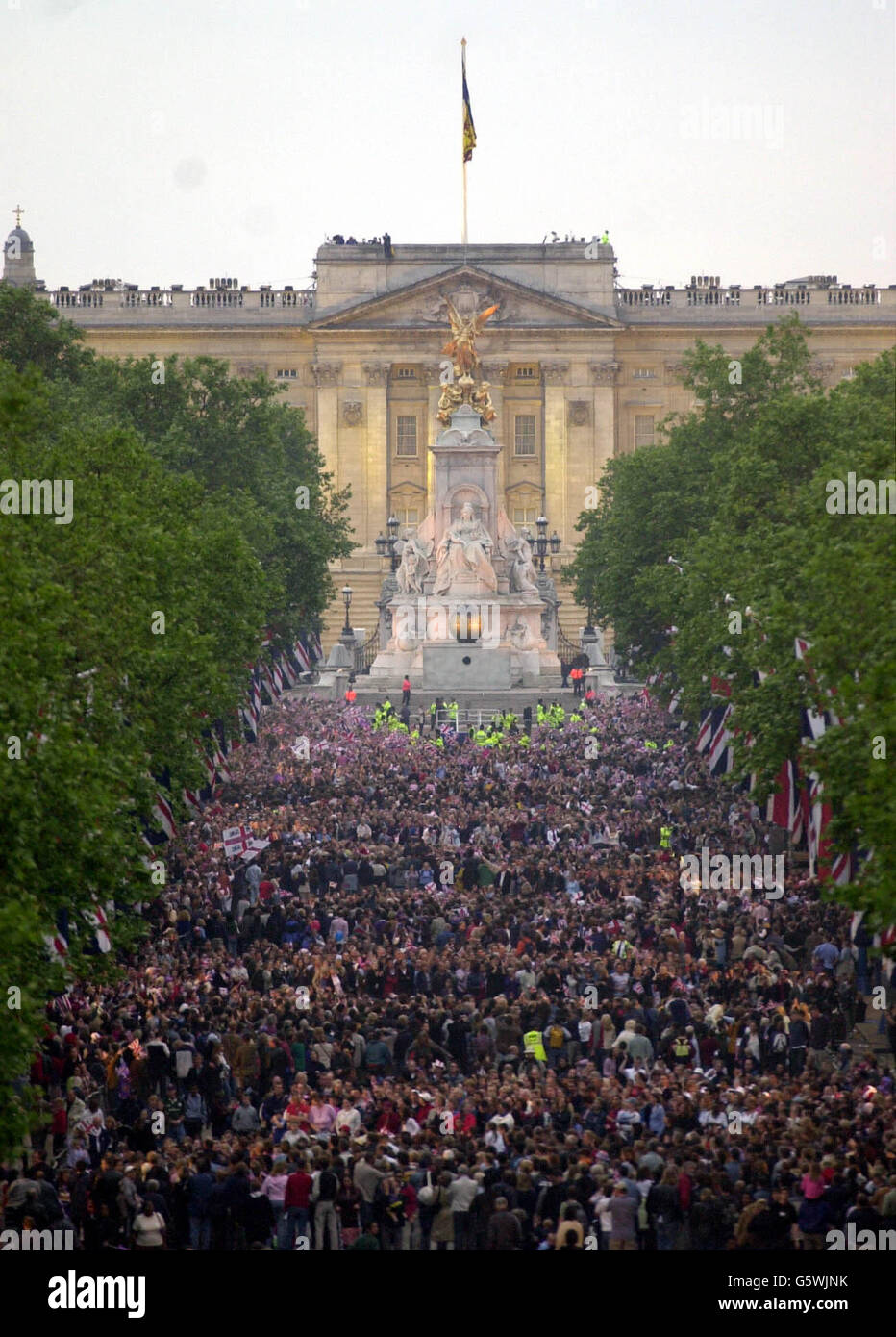 People throng The Mall as part of a crowd, estimated by police as up to one million strong, gathered outside Buckingham Palace, to listen to the second concert to commemorate the Golden Jubilee of Britain's Queen Elizabeth II. * Some 12,000 tickets were distributed by ballot for the Party at the Palace. Later The Queen was lighting a beacon and watching a firework display. On Tuesday she will travel to the St Paul's for a service of thanksgiving. Stock Photo