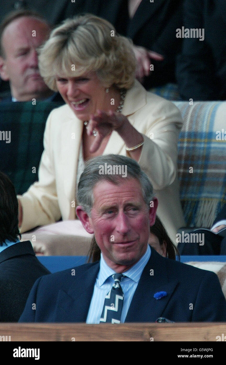 Camilla Parker Bowles looks on as Prince Charles enjoys the start of the Golden Jubilee pop concert in the gardens of Buckingham Palace in London. * Around 12,000 membersof the public attended a concert hosted by Britain's Queen Elizabeth II which featured music from Sir Paul MaCartney, Eric Clapton and Tom Jones among others. Stock Photo