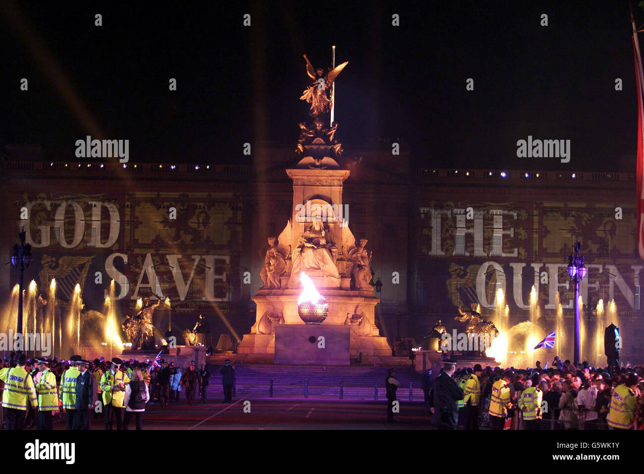 Queen Elizabeth II lit the final beacon, outside Buckingham Palace, to commemorate her Golden Jubilee. Earlier, some 12,000 people had watched the Party in the Palace - the second concert to be held in the grounds in three days. * ... ten of thousands more gathered outside to enjoy the music. On Tuesday she will travel to the St Paul's for a service of thanksgiving. Stock Photo