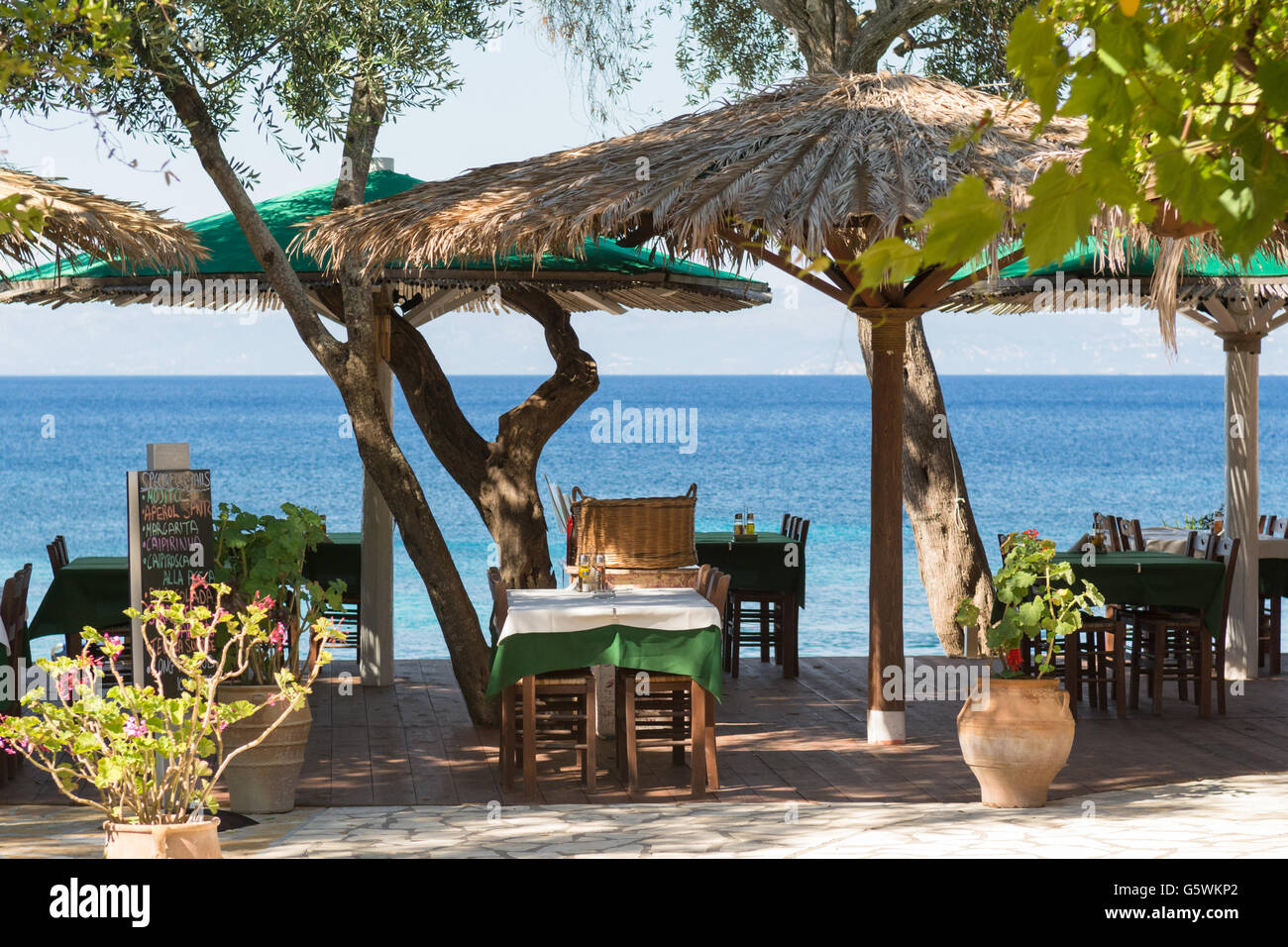 Paxos - 'Bastas Taverna' - Restaurant beach bar at Monadendri Monodendri on the tiny Ionian Island of Paxos, Greece, Europe Stock Photo