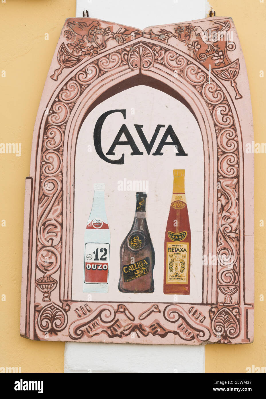 sign outside shop in Lakka, Paxos, Greece advertising Cava - Greek wine, Ouzo, Calliga and Metaxa Stock Photo