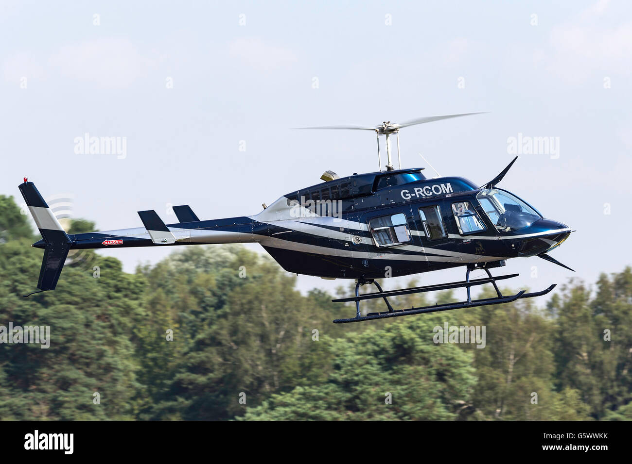 Bell 206L-3 Longranger III Helicopter G-RCOM arriving at Farnborough Airport. Stock Photo