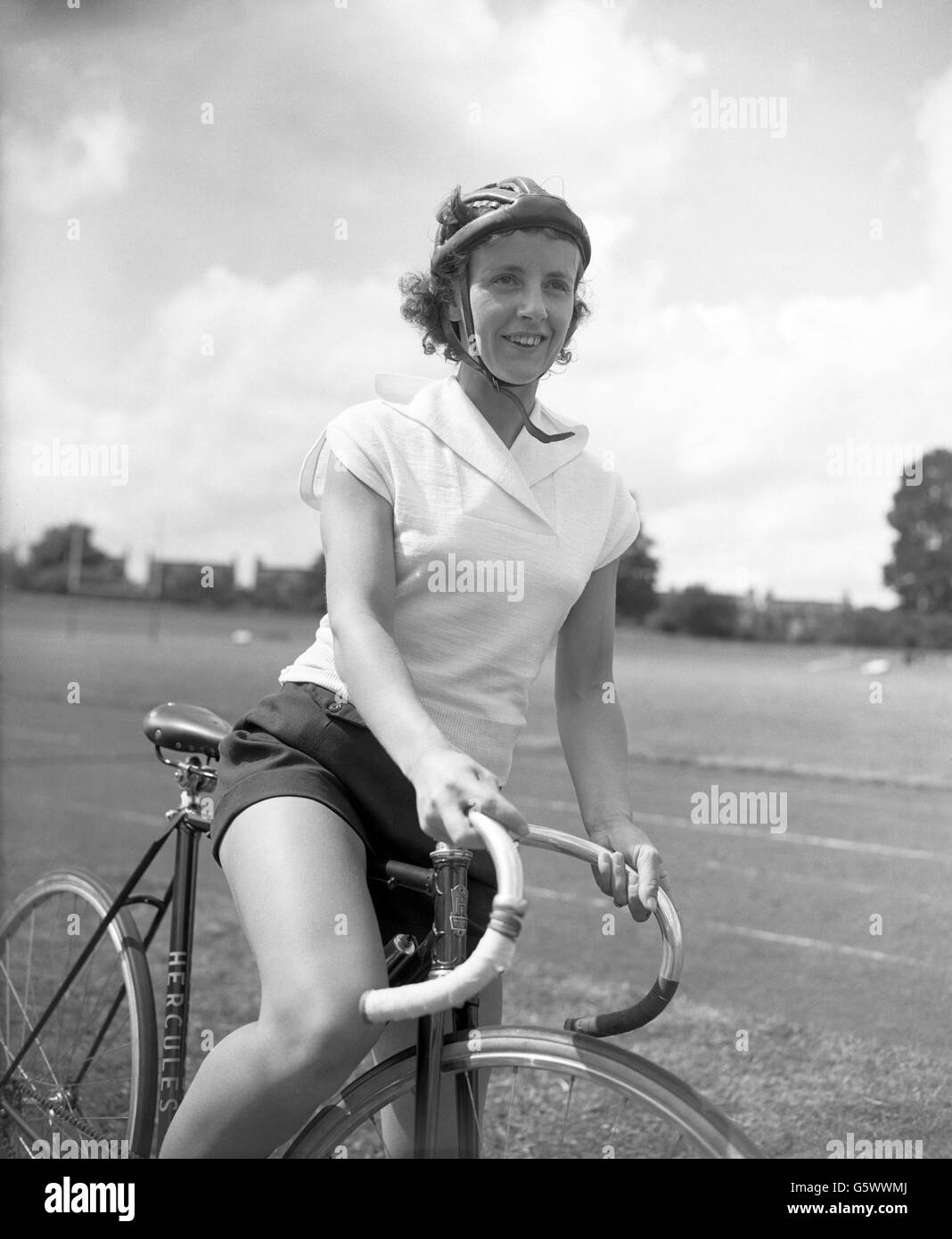 Training at Herne Hill cycle track in London is Eileen Sheridan, of Coventry, who is to make an attempt on the existing one-hour track record on Wednesday. She is considered one of the world's greatest all-round female cyclists and is holder of many records. Stock Photo