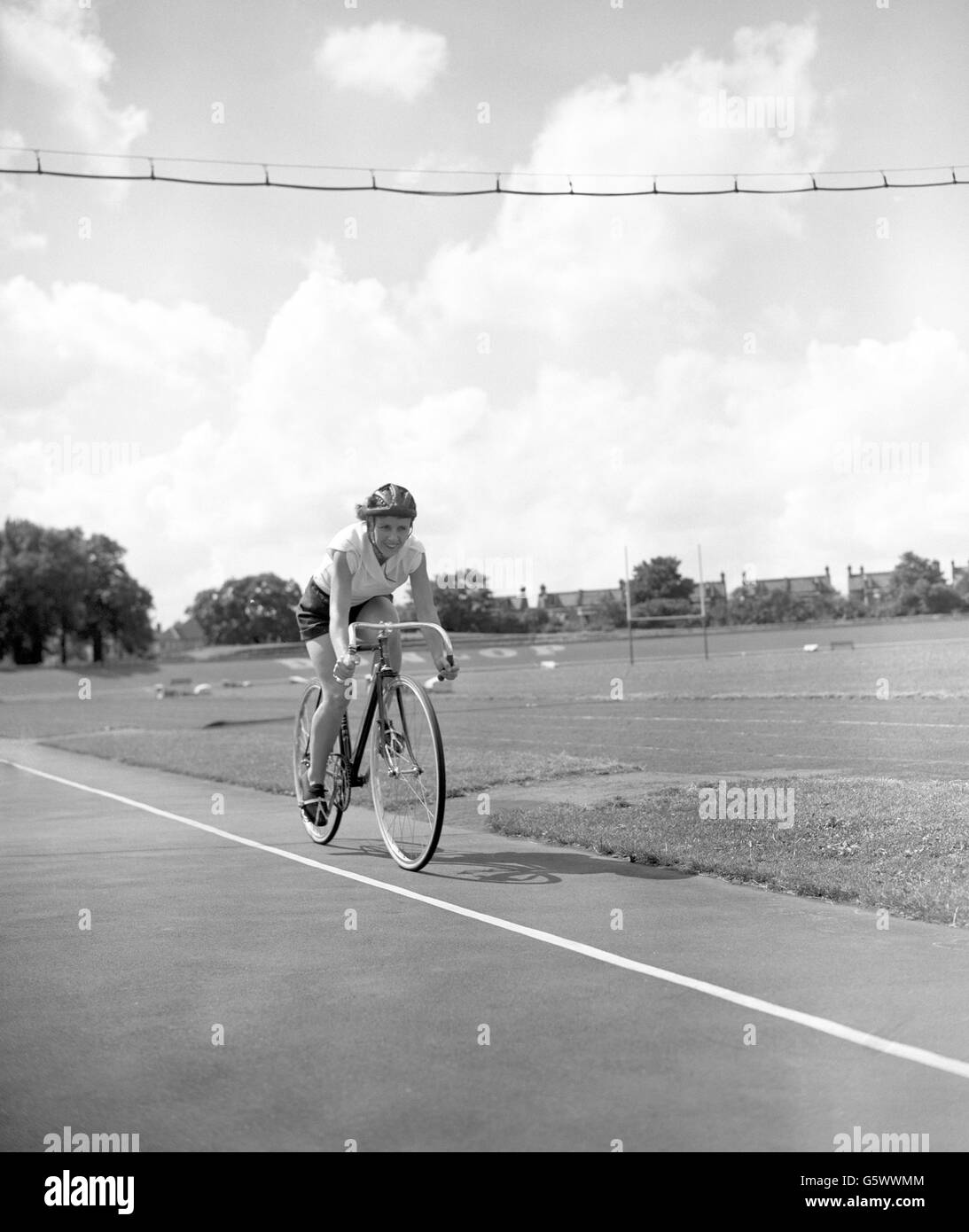 Training at Herne Hill cycle track in London is Eileen Sheridan, of Coventry, who is to make an attempt on the existing one-hour track record on Wednesday. She is considered one of the world's greatest all-round female cyclists and is holder of many records. Stock Photo