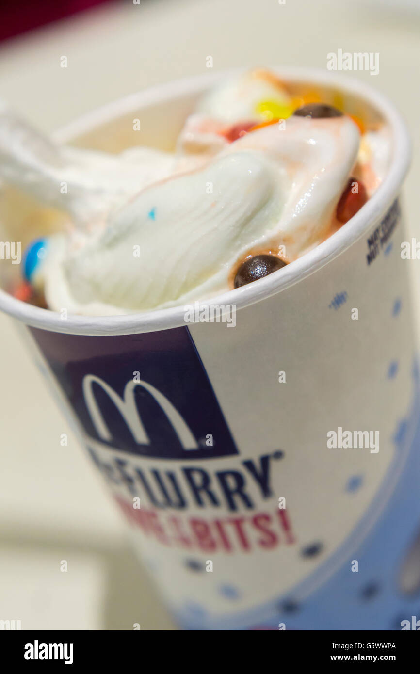 A mouth watering M&M McFlurry in a McDonald's restaurant in New York on Friday, June 17, 2016. Mars, the company behind the iconic M&M candies, is concerned about consumers eating too much sugar and is considering pulling their M&M's from fast food products such as the McFlurry, and Dairy Queen's Blizzard concoctions. Privately owned Mars Inc. is the world's largest confectioner and also makes Snickers, Mars Bars, Twix and other candies. (© Richard B. Levine) Stock Photo