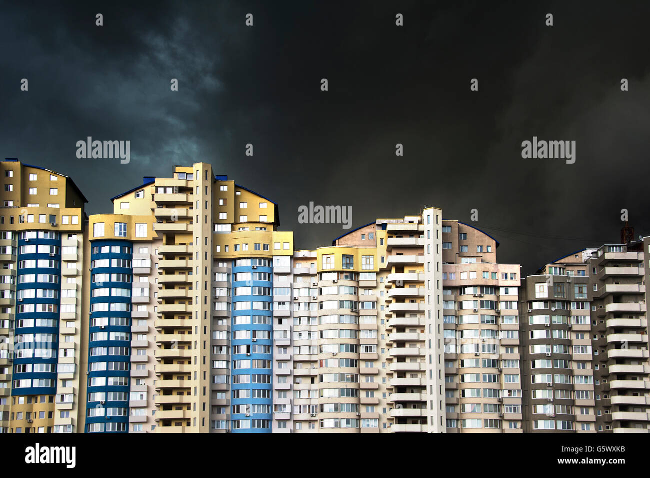 Apartment building under the heavy black rainy clouds Stock Photo Alamy
