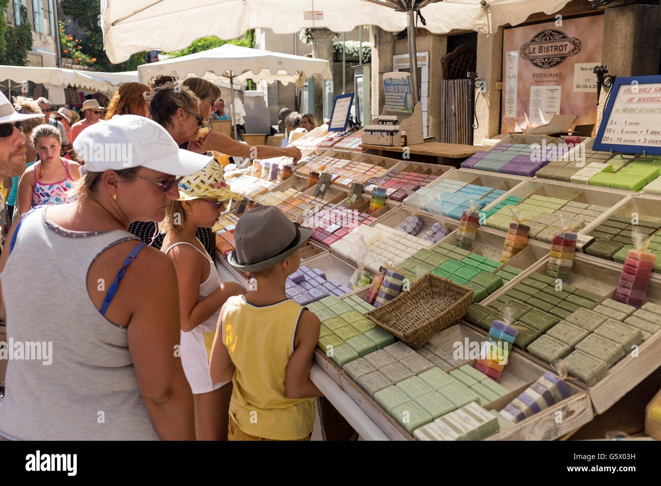 Outdoor market stall in Lourmarin selling various scented bars of soap, Luberon, Vaucluse, Provence-Alpes-Côte d'Azur, France Stock Photo