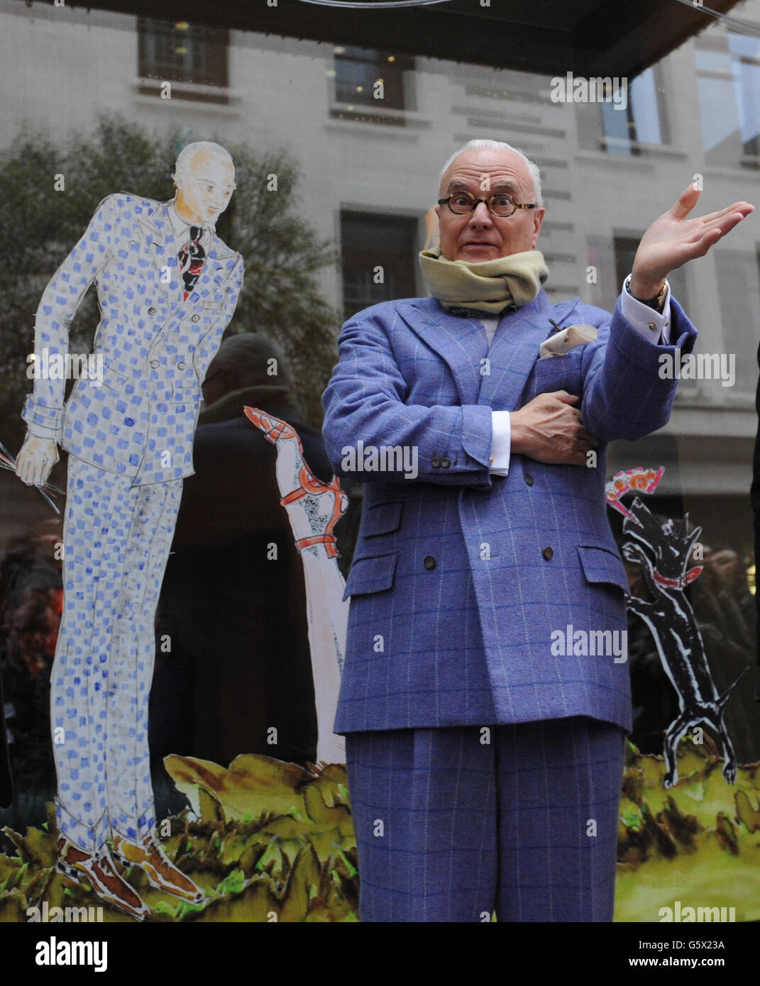 Spanish footwear designer Manolo Blahnik, unveils the windows display designed by him for London Fashion Week at The Mayfair Hotel, London, the official hotel to London Fashion Week. Stock Photo