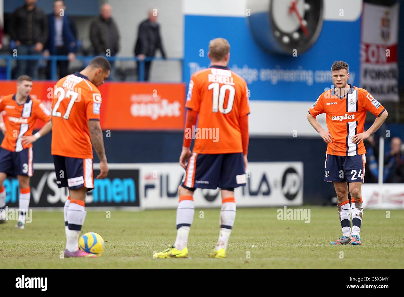 Luton Town's Greg Taylor, Andre Gray, Scott Rendell and Jonathan Smith  (left to right) stand dejected
