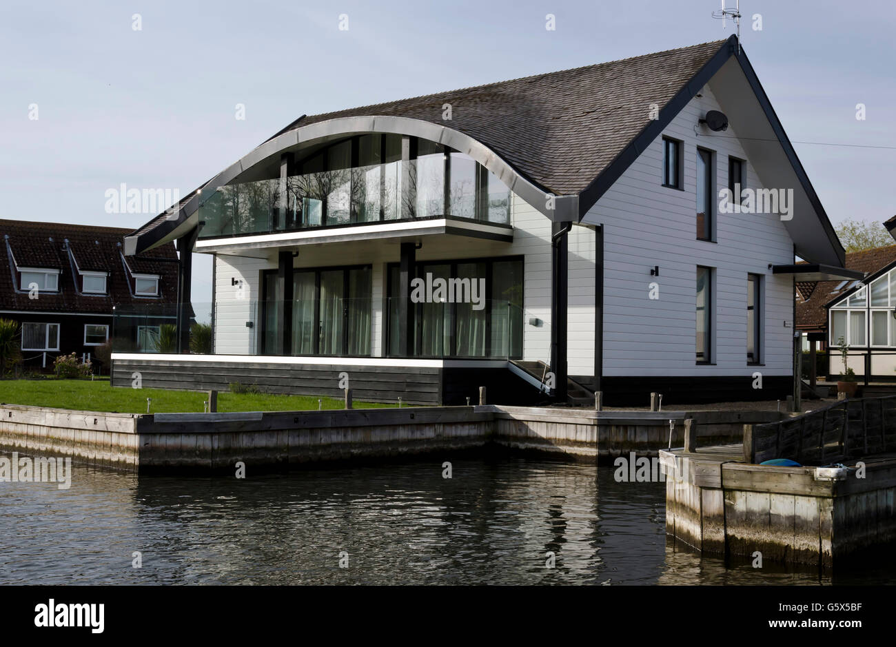Modern riverside house with a "thatched look" roof near Horning on the River Bure in the Norfolk