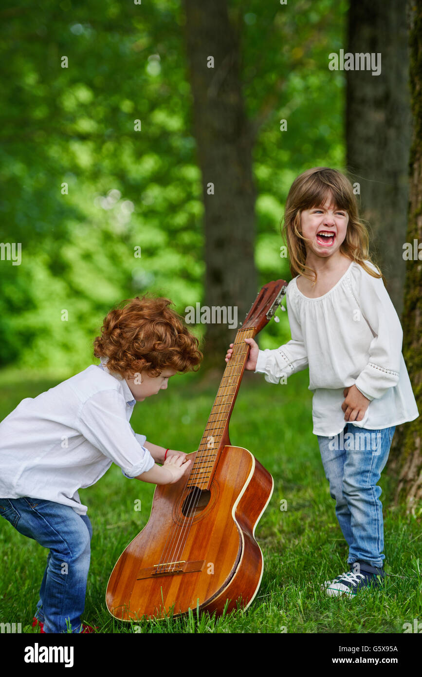 cute children playing guitar Stock Photo