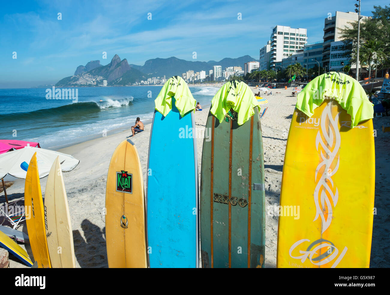 RIO DE JANEIRO - MARCH 30, 2016: Colorful surfboards stand lined up on the beach at Arpoador, a popular surf destination. Stock Photo
