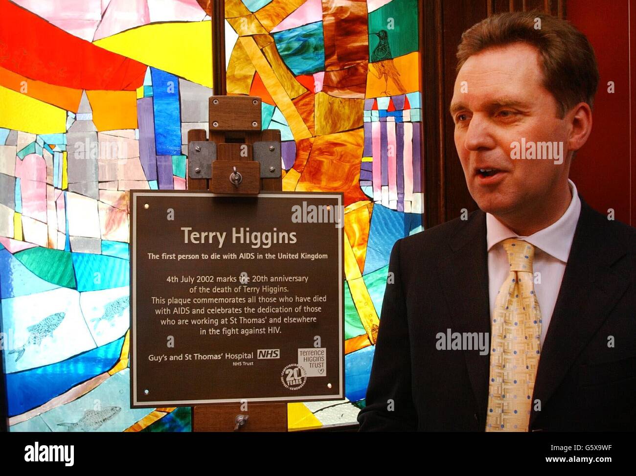 Health Secretary Alan Milburn In Front Of A Stained Glass Window At health-secretary-alan-milburn-in-front-of-a-stained-glass-window-at