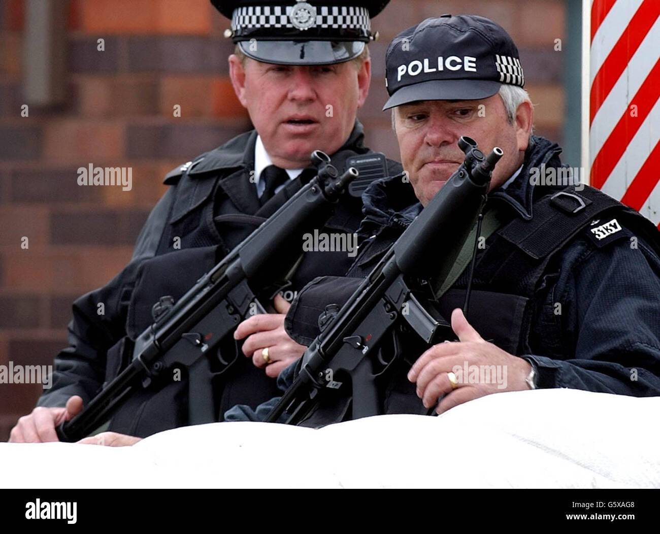 Armed Police patrol the Menwith Hill American air base near Harrogate, North Yorkshire, as security is tightened for the Independence Day celebrations. Stock Photo