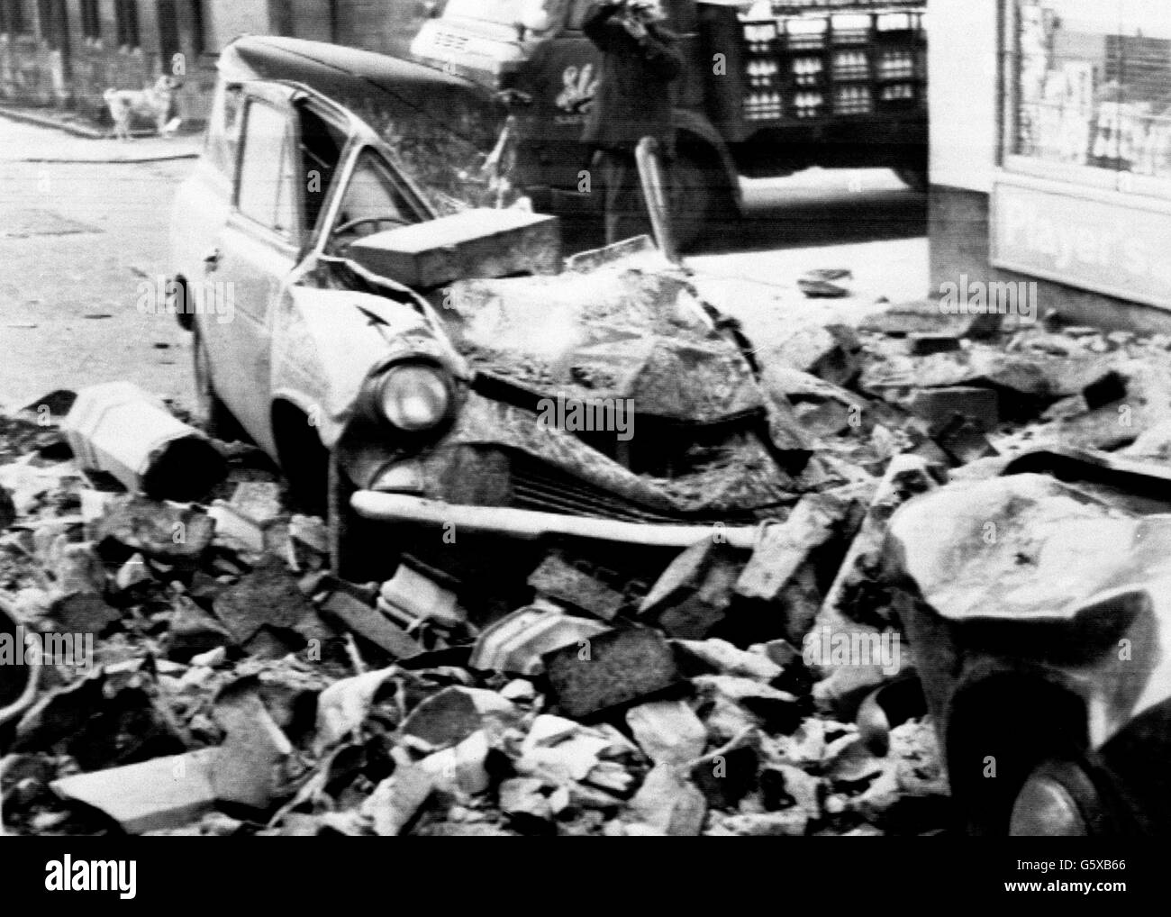 Two cars damaged by masonry blown down in Hurricane-force winds which caused havoc and cost nine lives in Glasgow, Scotland. Stock Photo