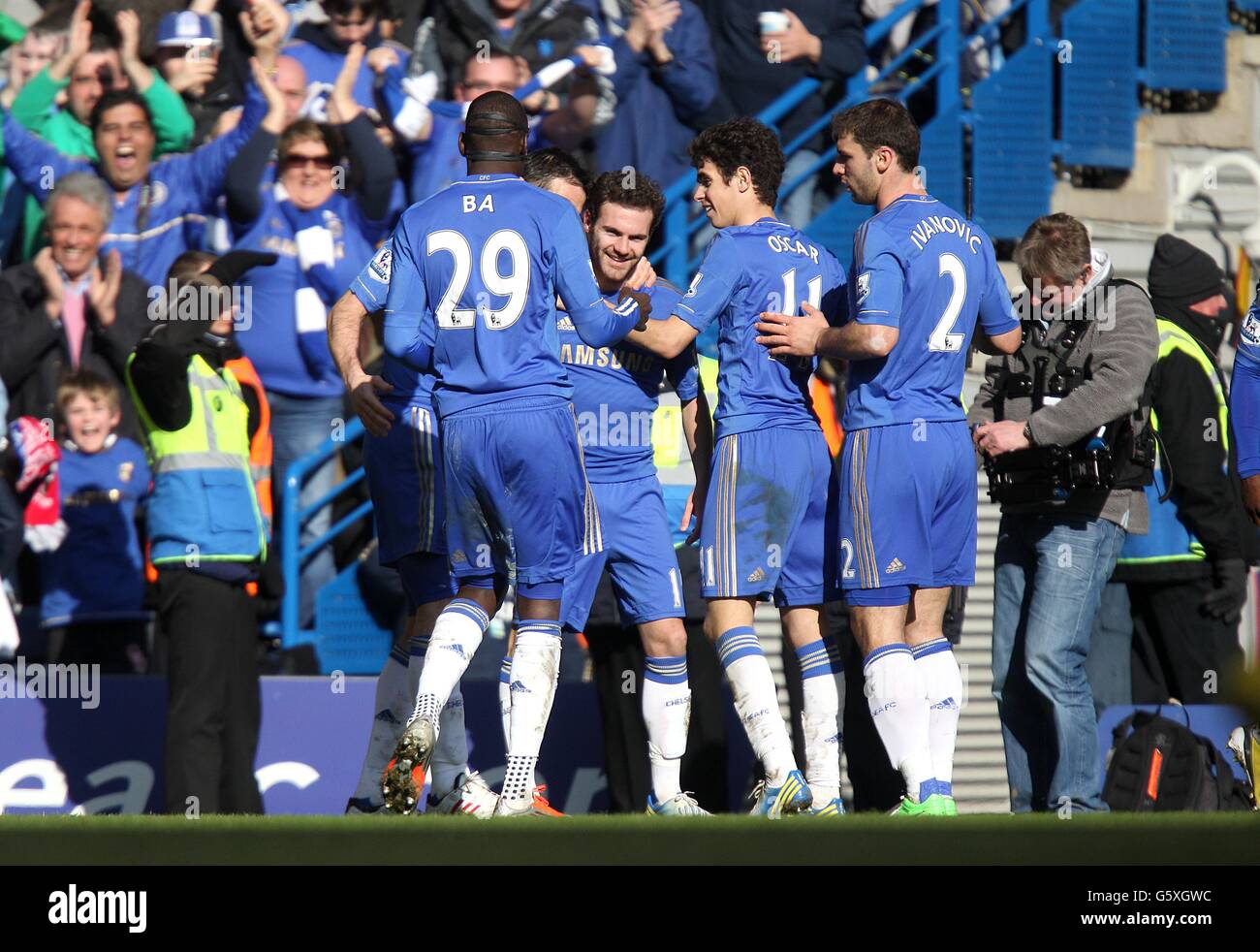 Chelsea's Juan Mata (centre) celebrates with team-mates after scoring their first goal of the game Stock Photo