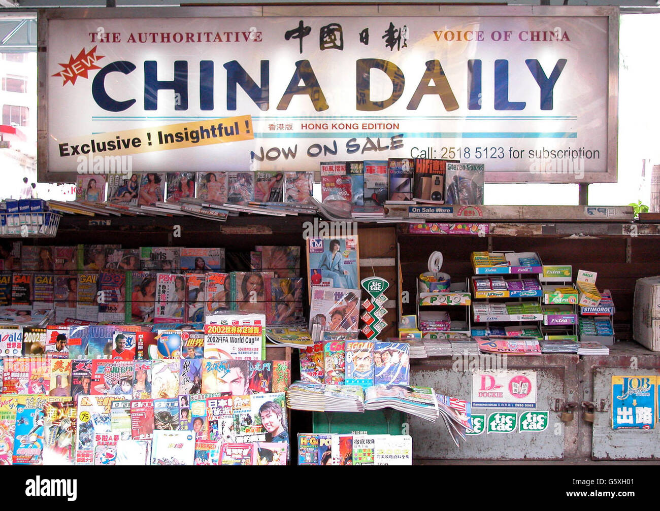 A newspaper stand selling magazines and Chinese newspapers. Stock Photo
