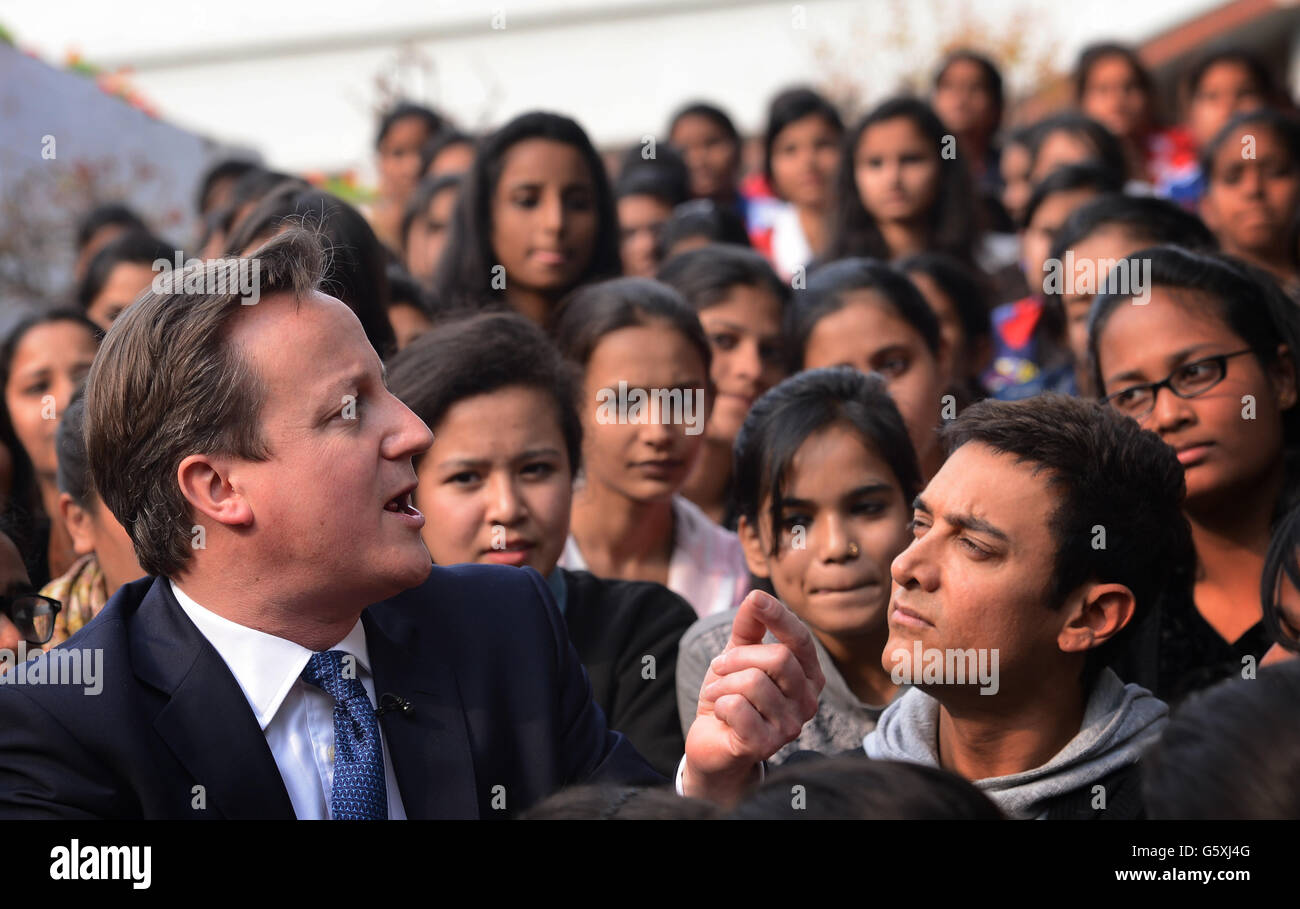 Prime Minister David Cameron with Bollywood superstar Aamir Khan (right) as he meets students at Janki Devi Memorial College, a girls only college, in Delhi, India during the second day of a three day visit to the country. Stock Photo