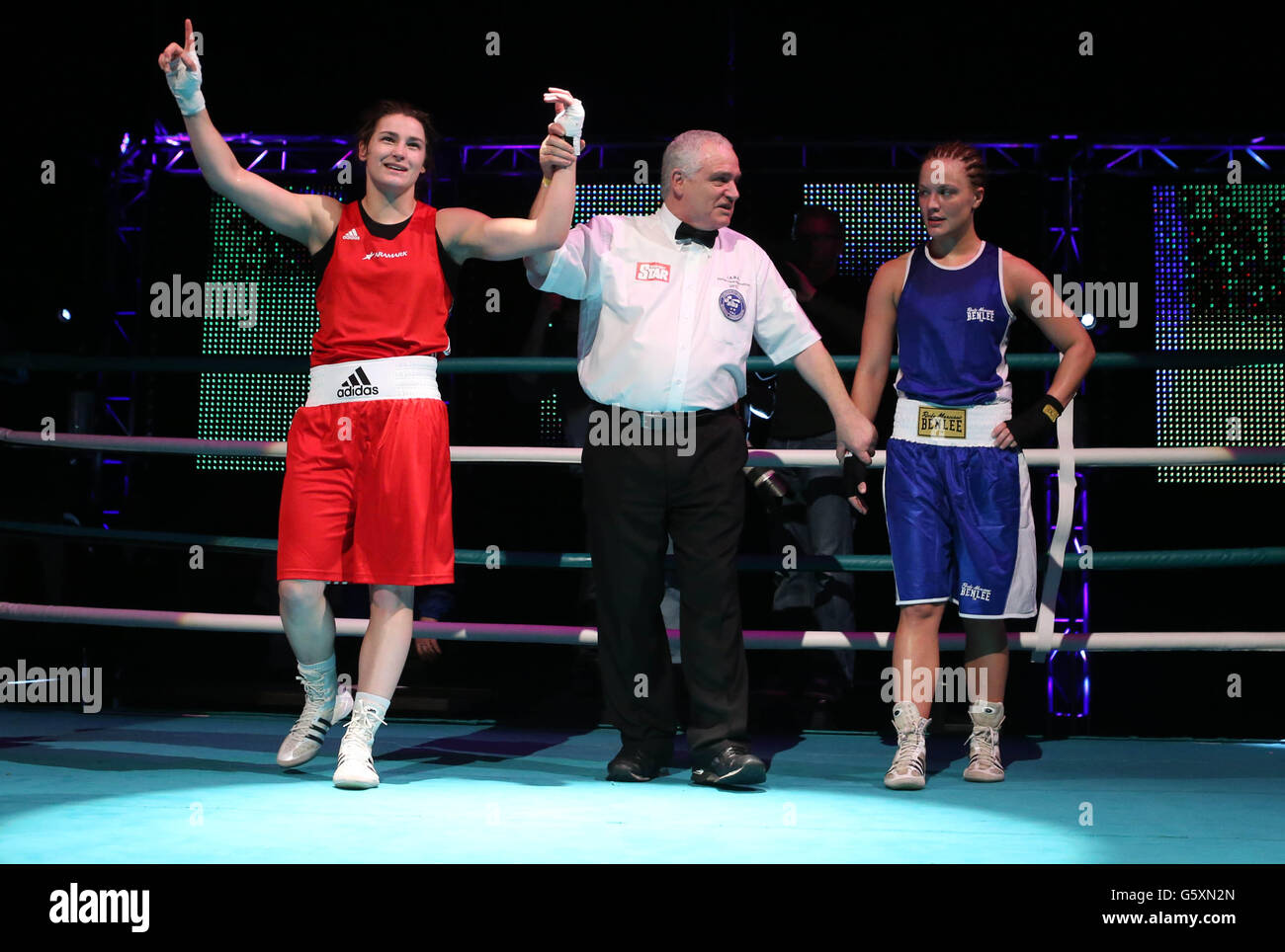 Katie Taylor (left) celebrates beating Maike Klueners during their bout at the Bord Gais Energy Theatre, Dublin, Ireland. Stock Photo
