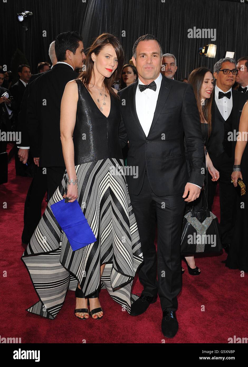 Mark Ruffalo and Sunrise Coigney arriving for the 85th Academy Awards at the Dolby Theatre, Los Angeles. Stock Photo