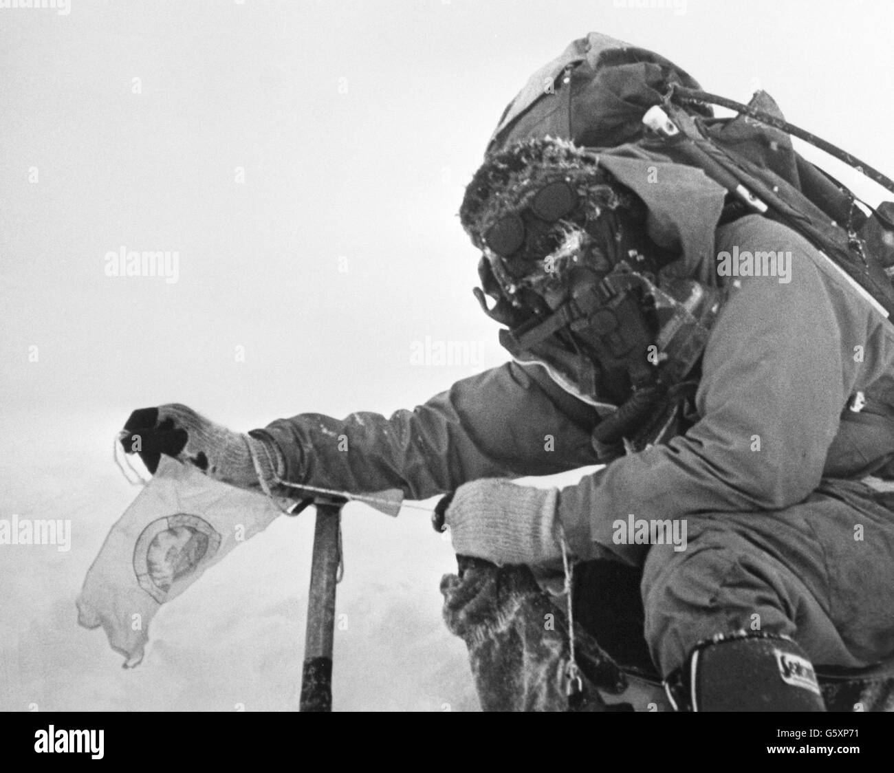 Corporal 'Bronco' Lane fixes a commemorative pennant on the summit of Mount Everest, after he and Sergeant 'Brummie' Stokes arrived there on May 16th. Stock Photo