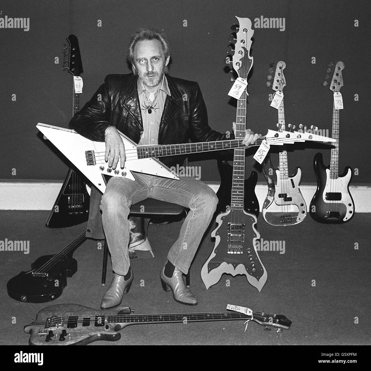 John Entwistle, bass player with rock group The Who, displays some of his guitars before a sale of rock memorabilia, at Sotheby's, London: 27/06/02: The Who's bass guitarist John Entwistle died in Las Vegas on the eve of the band's US tour. *..., a spokeswoman for the Clark County Coroner's Office in Las Vegas confirmed. Stock Photo