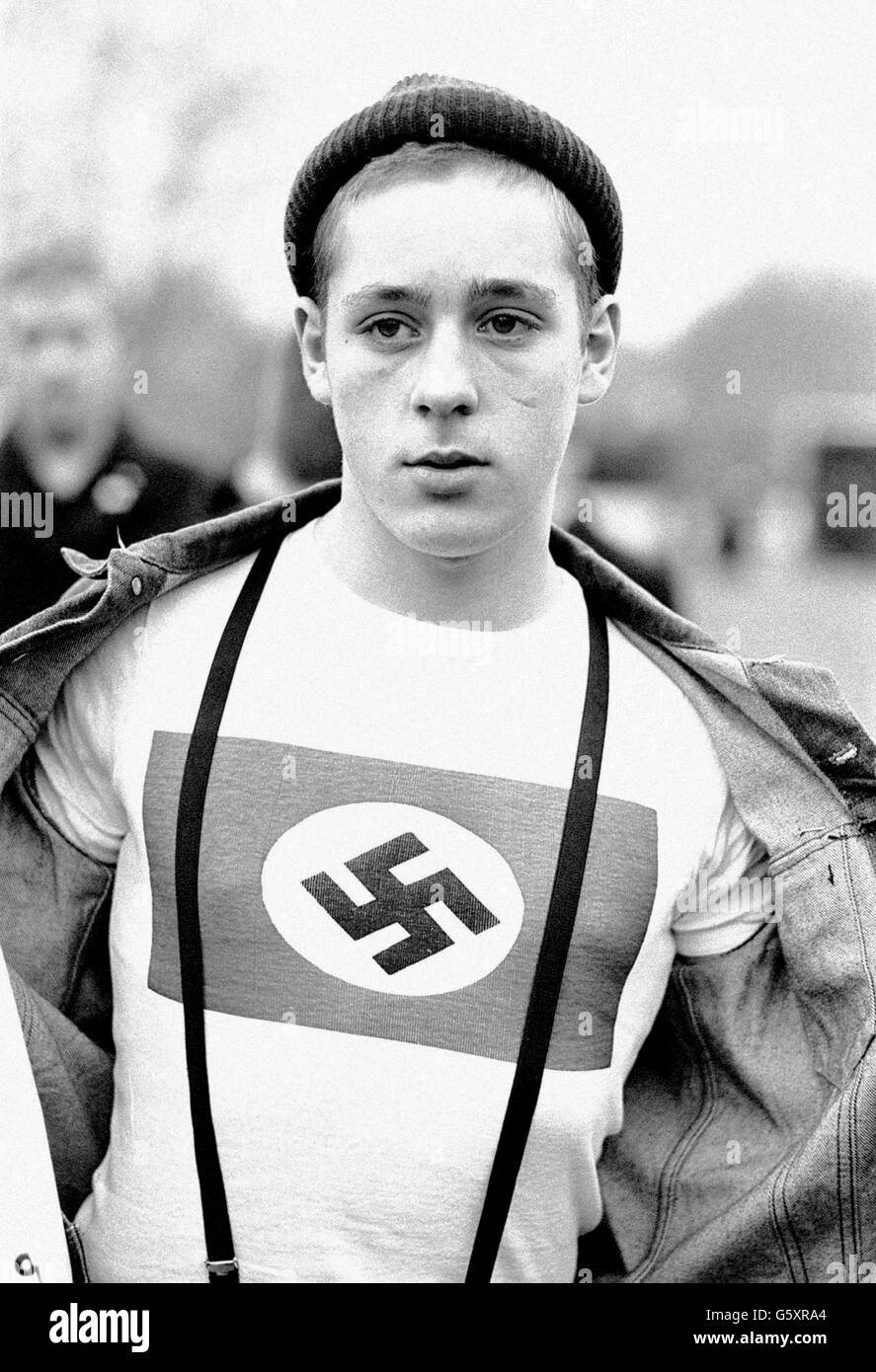 A youth displays his swastika t-shirt during a British Movement (splinter group of the National Front) march from Hyde Park to Paddington Recreation Ground. Stock Photo