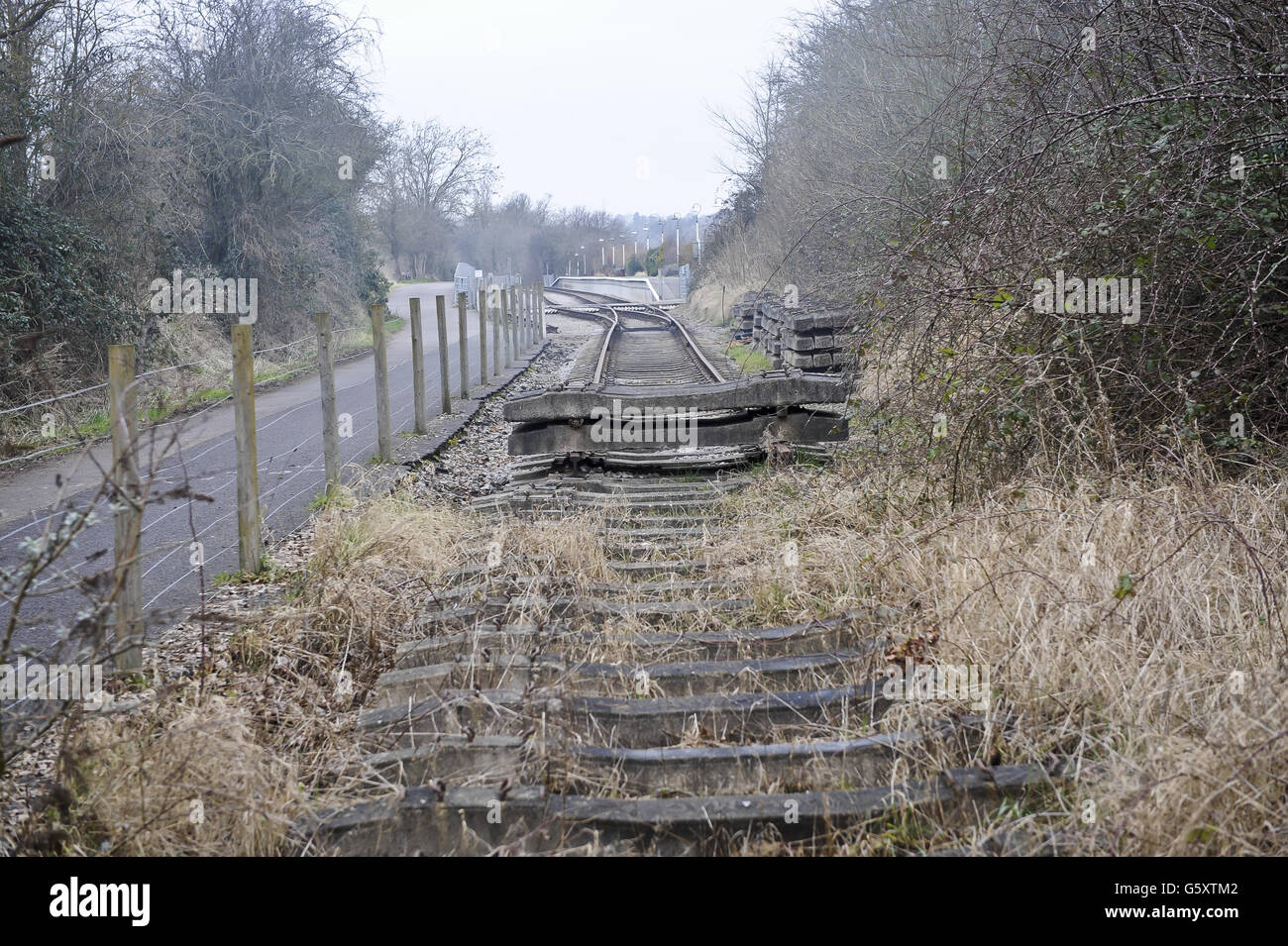 Concrete railway sleepers, without iron rails, which are on the end of the Avon Valley Railway on the Bristol & Bath railway path, pictured left of the frame. The Bristol & Bath Railway Path was constructed on the track bed of the former Midland Railway which closed for passenger traffic at the end of the 1960s. Between 1979 and 1986, the railway line was converted into the Railway Path by cycling charity Sustrans. The first stretch was between Bath and Bitton where the campaign group, Cyclebag obtained planning permission to create the 2m wide dust track. The route then developed westwards Stock Photo