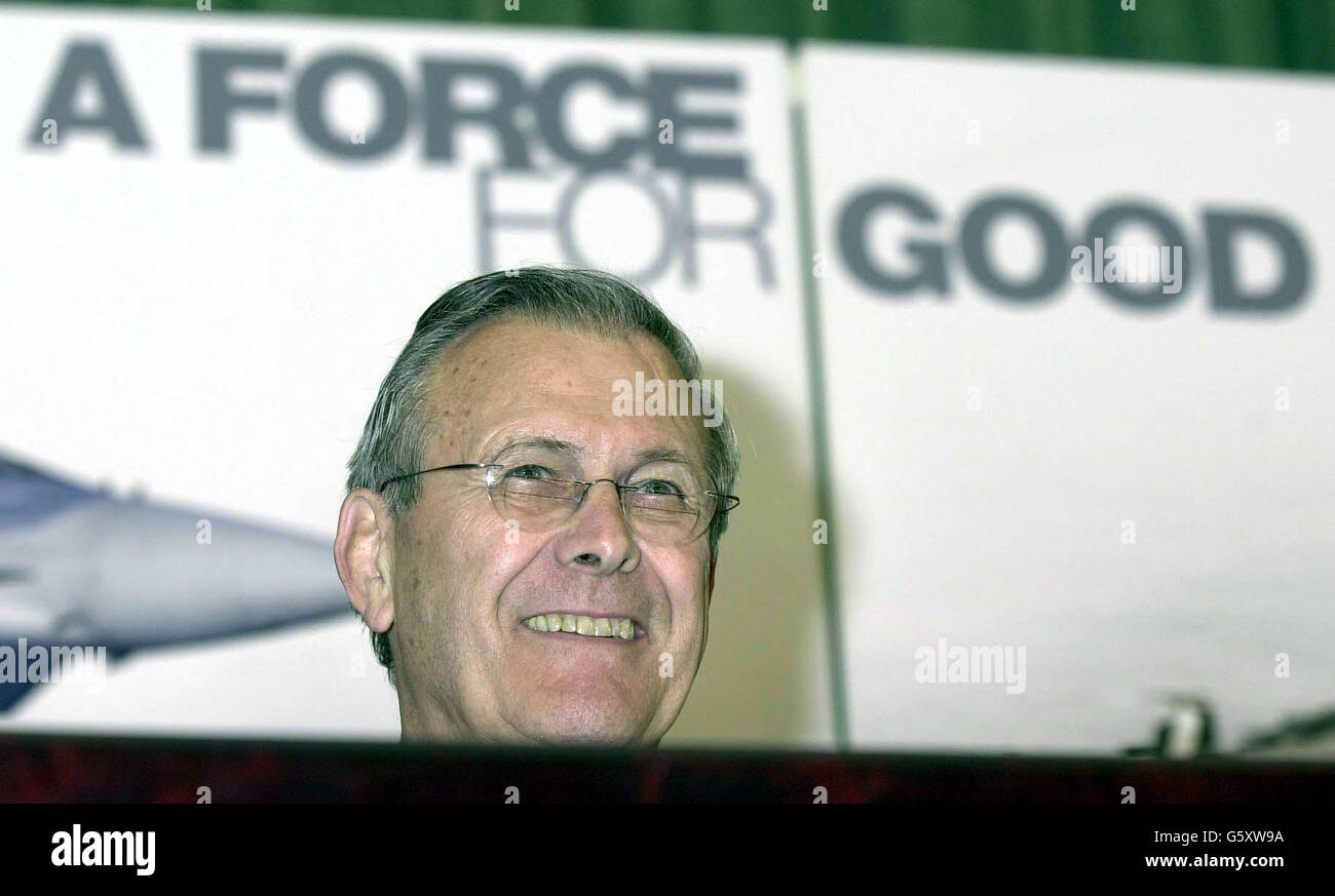 The United States Secretary of Defence Donald Rumsfeld smiles at a question, during a joint press conference with Minister of Defence Geoff Hoon, in Whitehall. 07/05/04: US defence secretary Donald Rumsfeld, who has faced growing demands to resign over the abuse by of Iraqi prisoners by US soldiers. But President George Bush has said: He'll stay in my Cabinet. Stock Photo