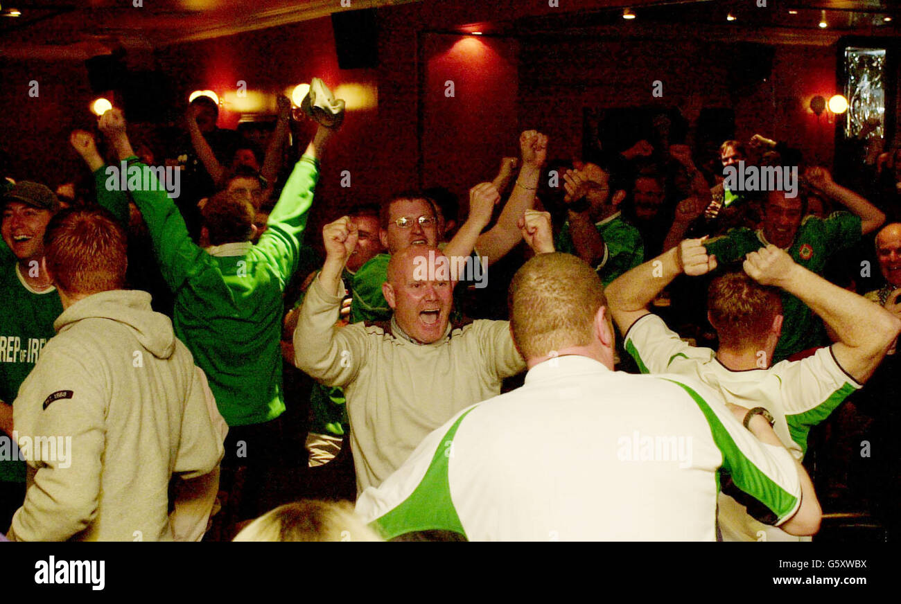 Irish football fans celebrate after Robbie Keane's last-gasp equaliser against Germany in their World Cup group game, while watching the game on television in the London branch of the Republic of Ireland's Supporter's Club in McGoverns, Kilburn in north London. * Ireland have now accumlated two points from their first two fixtures and now face Saudi Arabia in their third and final group match to determine whether they qualify for the second round. Stock Photo