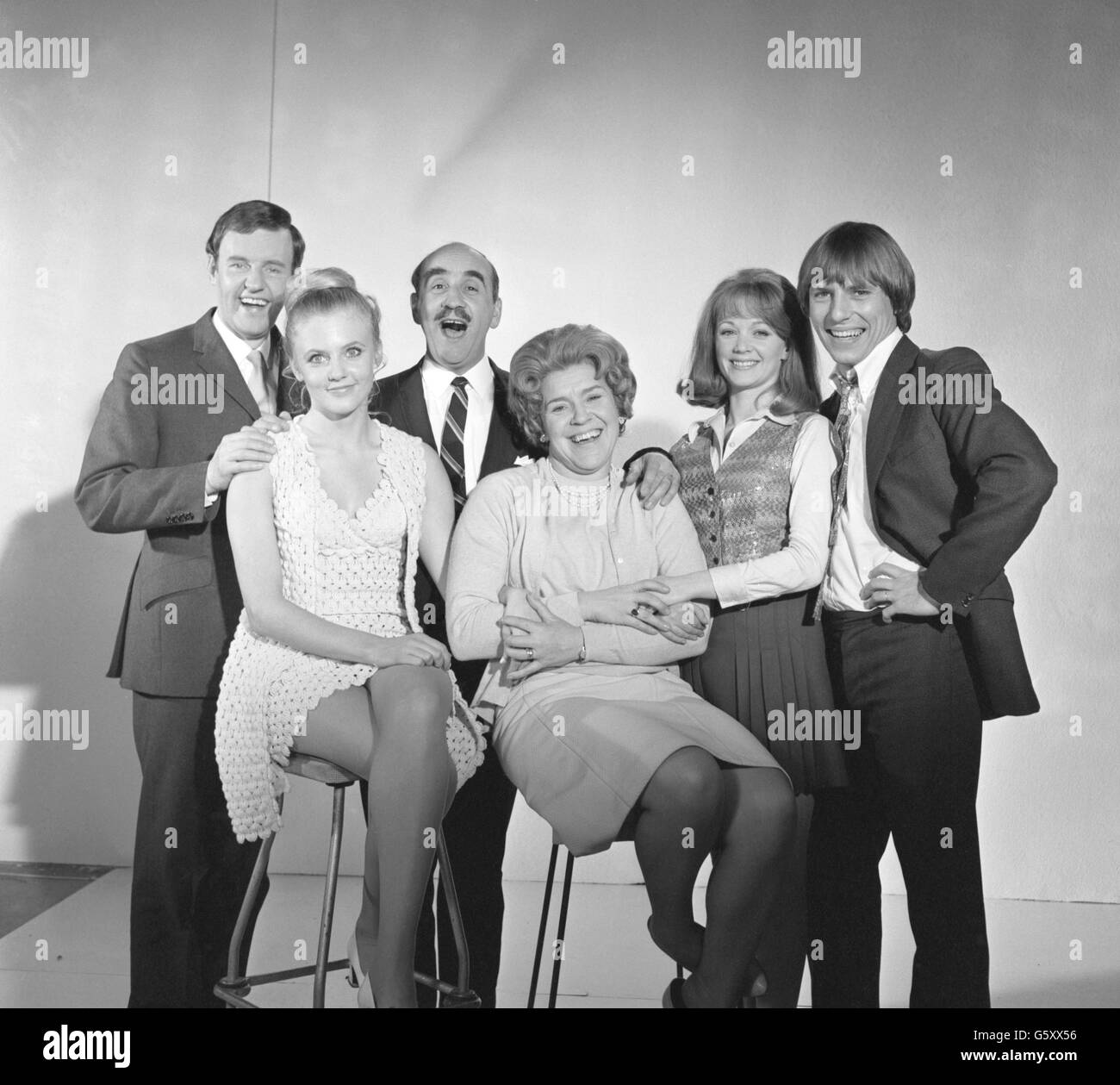 Actor Warren Mitchell, who is set to star in Granada's new film 'All The Way Up', is seen here with members of his new onscreen family, from left, Richard Briers (Son-in-law), Vanessa Howard (Daughter), Pay Heywood (Wife), Elaine Taylor (Daughter) and Kenneth Cranham (Son). The film opens at London's Plaza Theatre on June 11th and has also been selected to open ABC's streamlined twin-cinema in Bournemouth on June 13th. Stock Photo