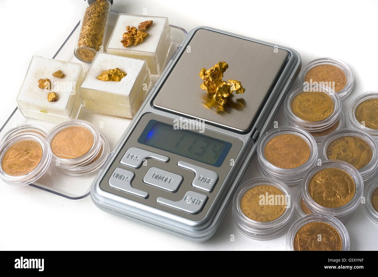 precision scales for weighing gold coins or useful nugget for the purchase  and sale of the precious metal Stock Photo - Alamy