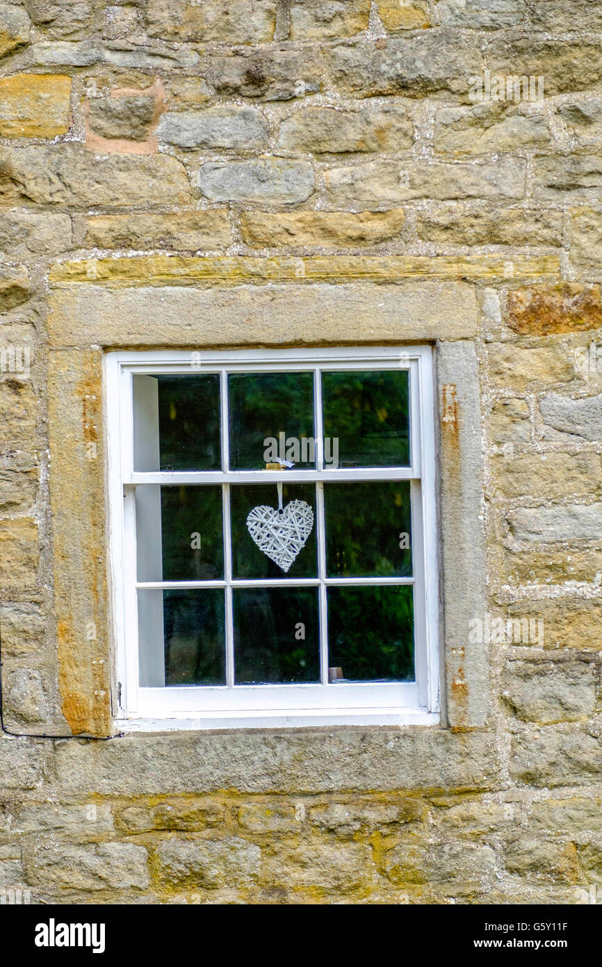 Heart in window Stock Photo - Alamy
