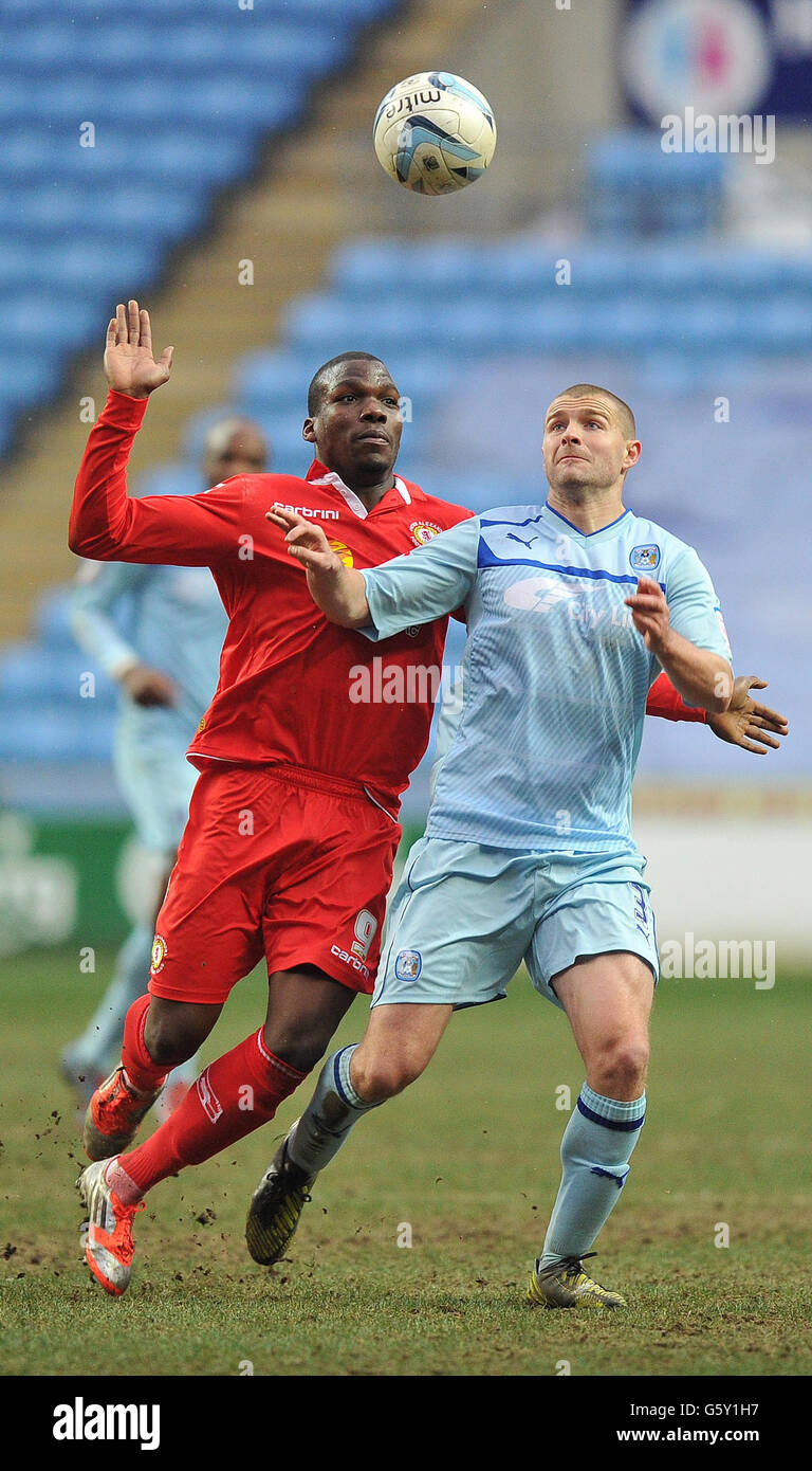 Coventry City's Carl Dickinson and Crewe Alexandra's Mathias Pogba battle for the ball during the npower League One match at the Ricoh Arena, Coventry. Stock Photo