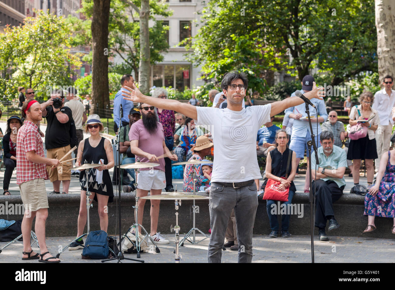 Brian Chase of the Yeah Yeah Yeahs leads percussionists on cymbals at a performance of his work 'Shimmer' during the summer Make Music New York festival in Madison Square Park in New York on Tuesday, June 21, 2016.  Make Music New York coordinates over 1,000 free concerts in public spaces on the first day of Summer. 'Shimmer' explores the sonic potential of cymbals.  (© Richard B. Levine) Stock Photo