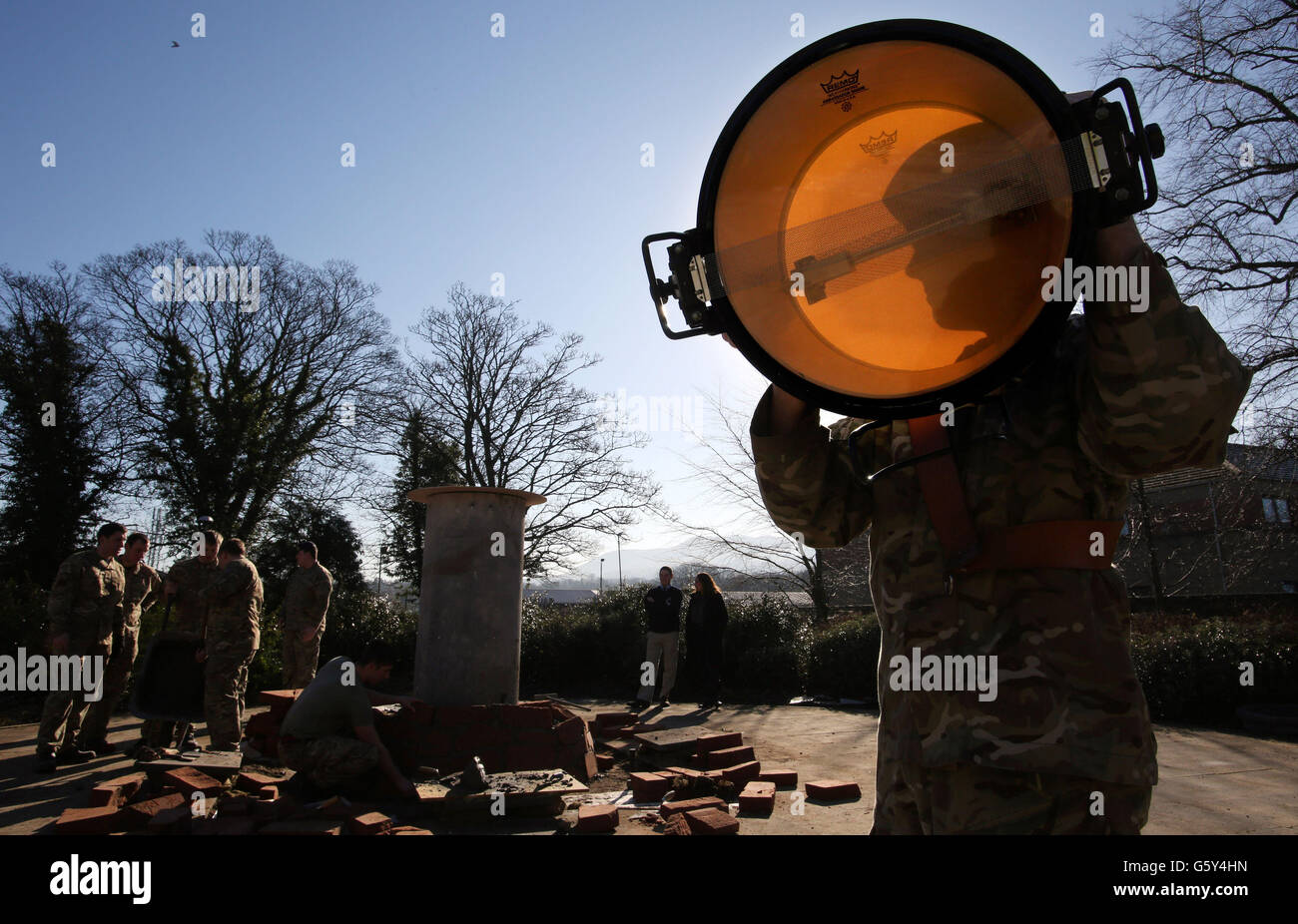 Soldiers from 39 Engineer Regiment build a memorial cairn for pipers and drummers killed in war at the Redford Barracks, Edinburgh. Stock Photo