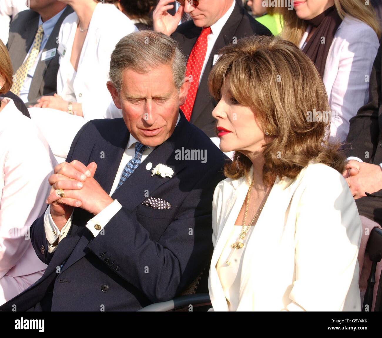 The Prince of Wales with Joan Collins as they watch Diana Ross perform at the Safeway Picnic 2002 in London's Hyde Park. Stock Photo