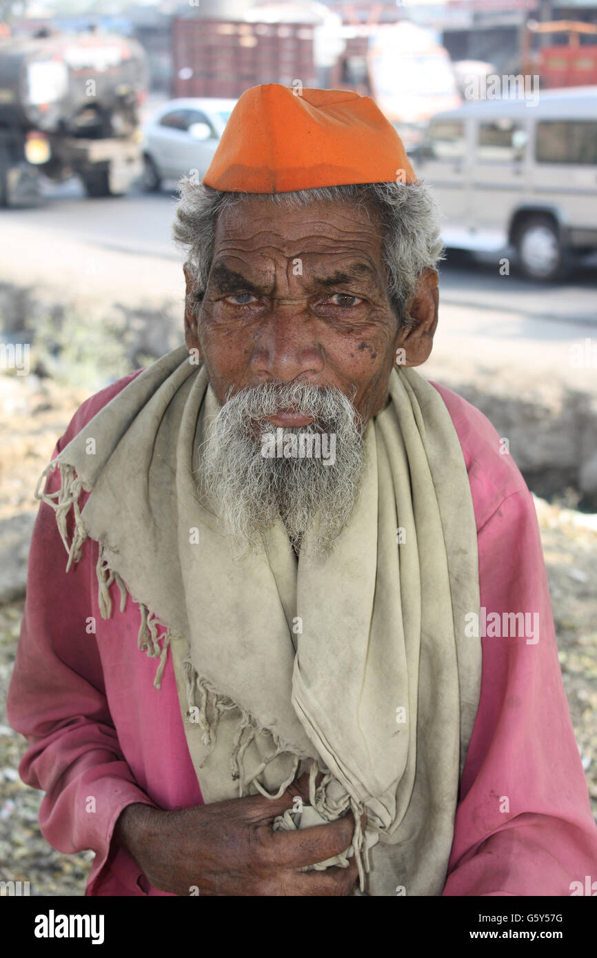 A portrait of an old Indian beggar, on the streets. Stock Photo