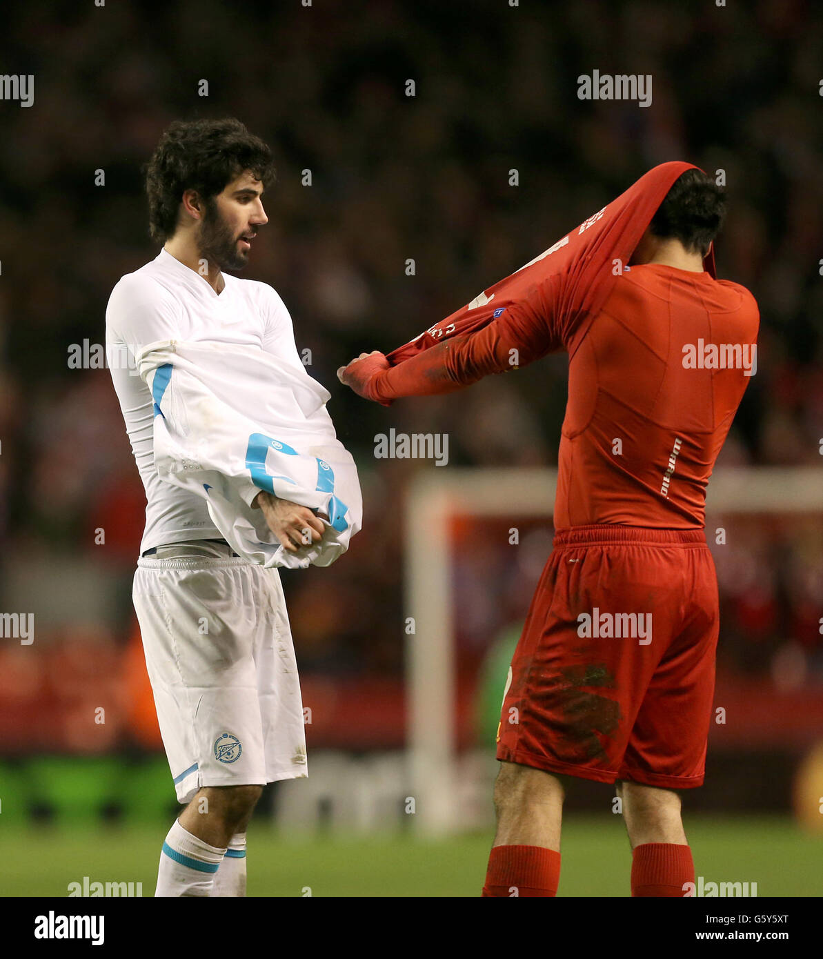 Liverpool's Luis Suarez (right) and Zenit St Petersburg's Carlos Luis Neto swap shirts at the final whistle Stock Photo