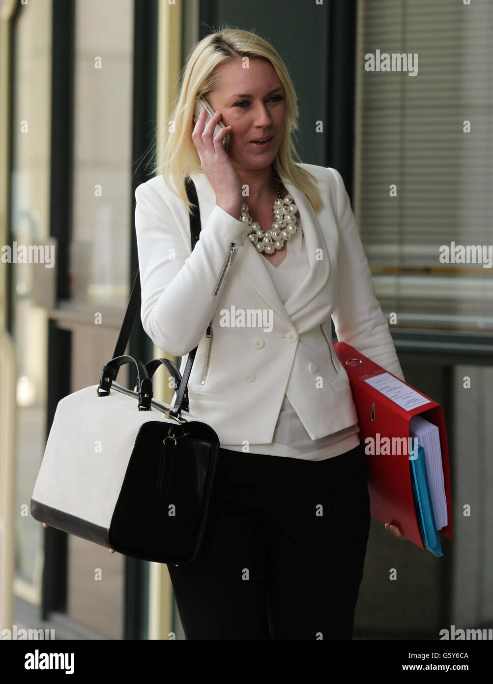 Stella English returning after lunch to a constructive dismissal hearing she brought against Lord Sugar at an East London Employment Tribunal Service at Anchorage House in East India Quay, London. Stock Photo