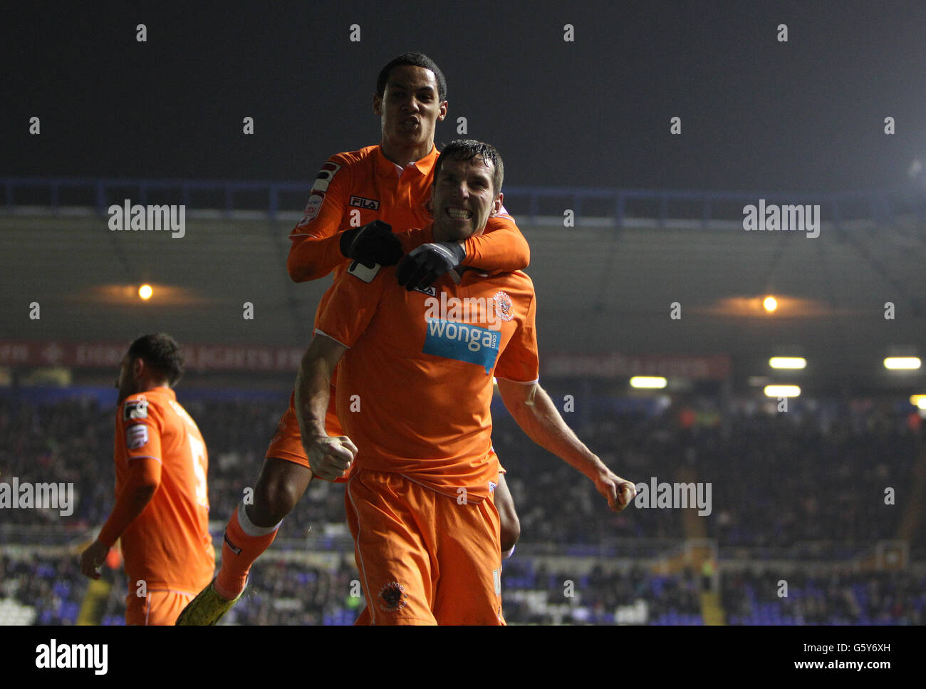 Blackpool's Kirk Broadfoot (right) celebrates scoring their equalising goal with teammate Thomas Ince (left) Stock Photo
