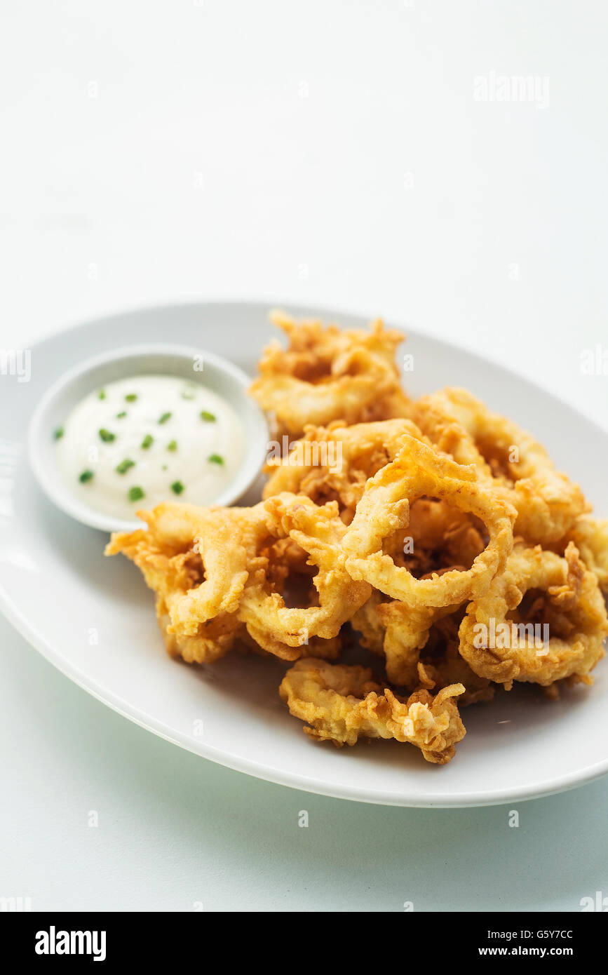 calamares calamari fried battered squid rings seafood snack with aioli sauce Stock Photo