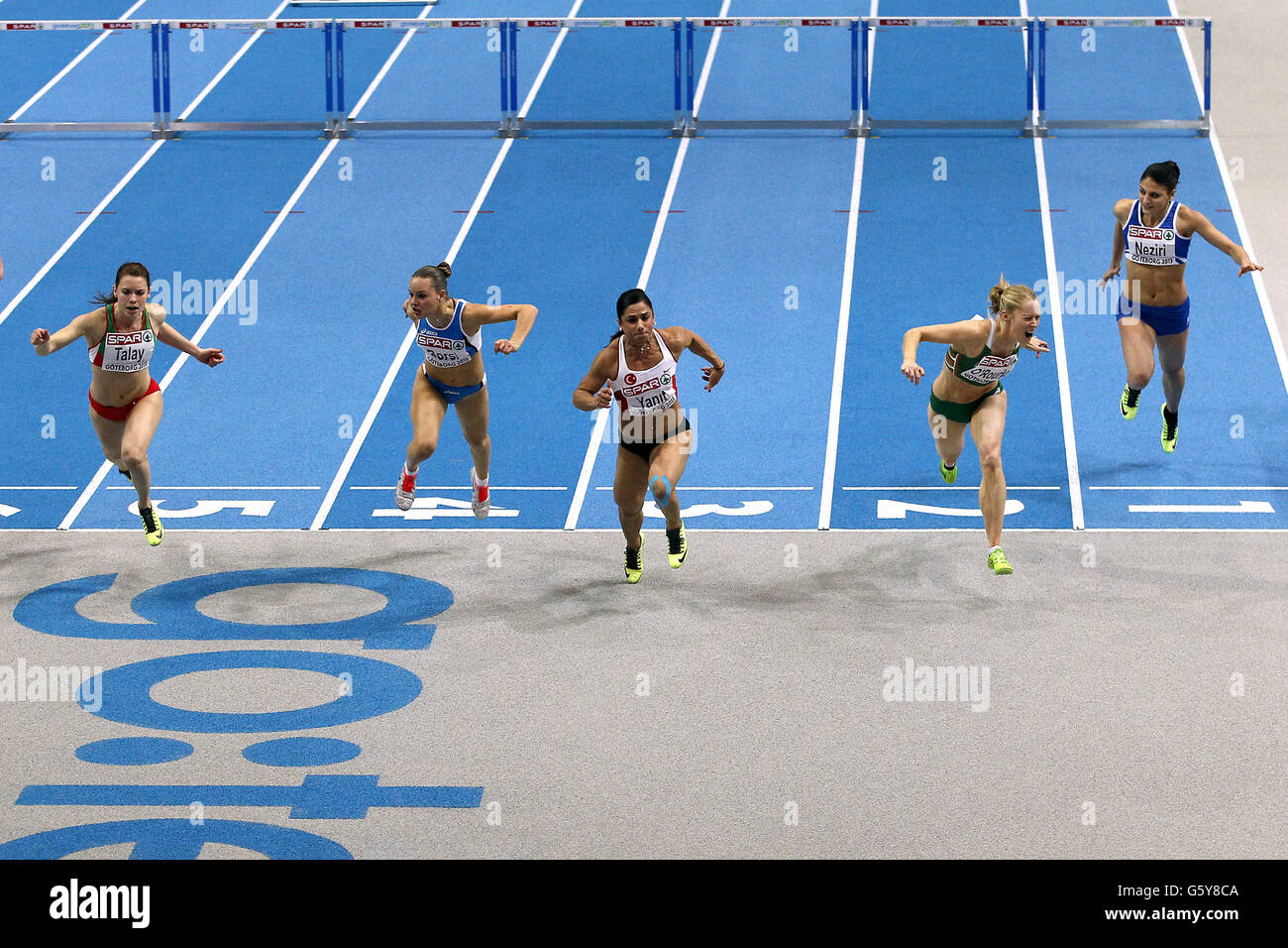 (Left to Right) Belarus' Alina Talay, Italy's Veronica Borsi, Turkey's Nevin Yanit, Italy's Derval O'Rourke and Finland's Nooralotta Nazri cross the finish line in the Womens 60 metres hurdles final Stock Photo